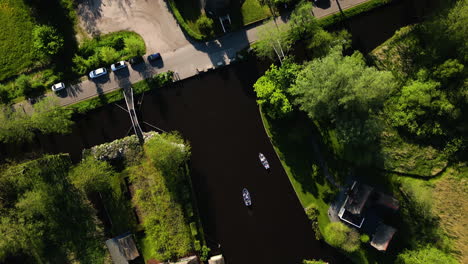 Water-canal-and-old-buildings-of-Giethoorn-township,-aerial-top-down-view