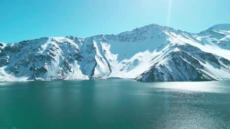 snowy-El-Yeso-reservoir-in-autumn,-Cajon-del-Maipo,-country-of-Chile