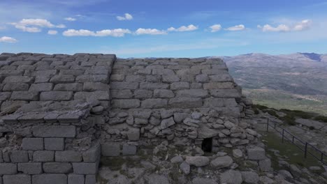 lateral-flight-with-a-drone-and-a-close-up-of-the-14th-century-hermitage-of-San-Pedro-where-we-appreciate-its-carved-masonry-and-its-amazing-vaulted-shape-being-in-a-state-of-deterioration