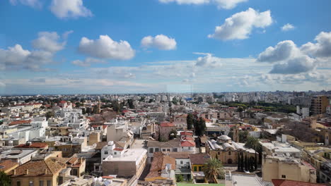 A-rooftop-view-of-Nicosia,-Cyprus,-with-various-buildings,-including-high-rises-and-residential-areas