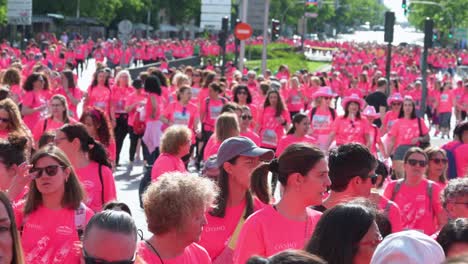 Thousands-of-participants-in-pink-shirts-join-Madrid's-Women's-Race,-raising-awareness-about-metastatic-breast-cancer-in-Madrid,-Spain