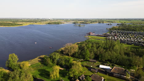 Countryside-village-of-Giethoorn-on-lakeside,-aerial-drone-view