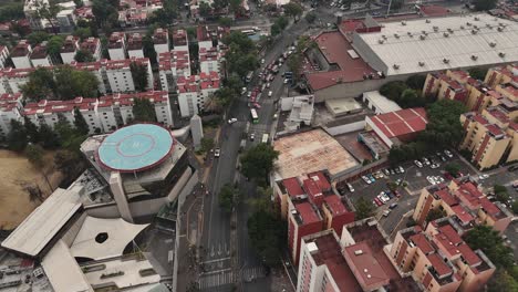 Aerial-view-of-the-southern-area-of-Mexico-City,-helipad-in-the-middle-of-residential-areas