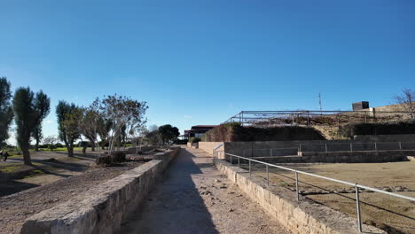 Ground-level-view-of-a-pathway-leading-through-an-archaeological-site-in-Pafos,-Cyprus