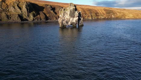 Drone-shot-of-Hvitserkur-rock-formation-on-water-in-Iceland-during-winter3