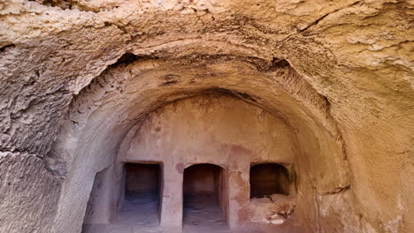 Ancient-tomb-carved-into-the-rock-in-Pafos,-Cyprus