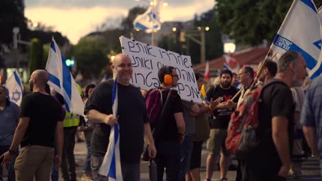 Editorial-Haifa,-Israel---05-25-2024:-People-with-signs-calling-for-peace-talk,-ceasefire-and-hostage-deal,-protest-march-near-Horev-center-Haifa,-Israel