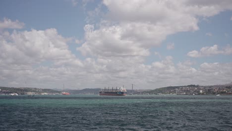 Ships,-ferries,-boats,-historical-buildings-in-the-Bosphorus,-Istanbul,-Turkiye