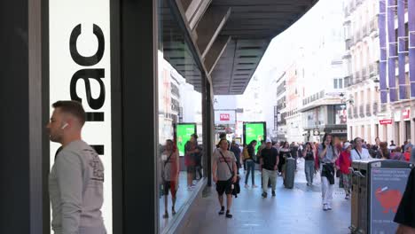 A-flow-of-customers-and-pedestrians-are-seen-at-the-French-electronics-and-cultural-multinational-chain-Fnac-store-in-Madrid,-Spain