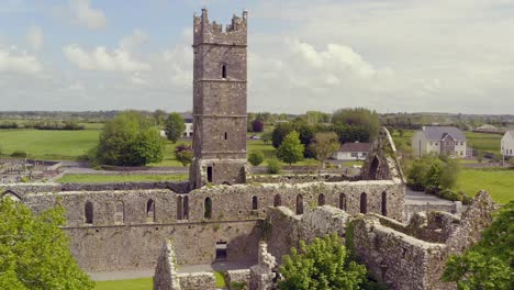 Claregalway-Friary-aerial-establishing-dolly-to-broken-stone-wall-siding-and-windows