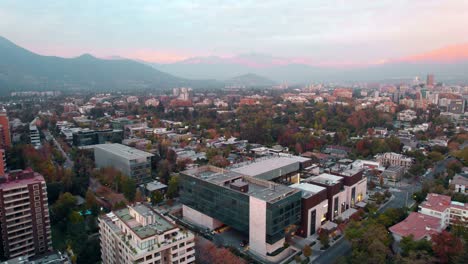 Aerial-view-toward-the-Casa-Costanera-Mall-at-Vitacura,-sunset-in-Santiago-de-Chile