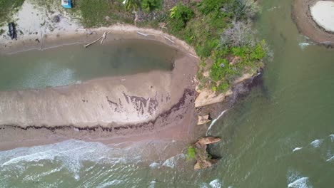 Drone-flying-over-river-and-ocean