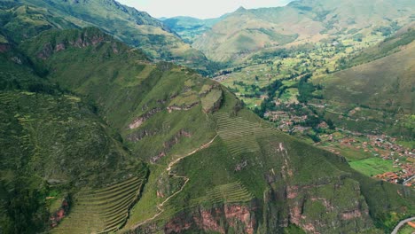 Enjoy-an-aerial-view-of-the-ancient-ruins-of-Pisac,-with-its-terraces,-pathways,-and-charming-villages-in-the-Sacred-Valley-of-the-Incas