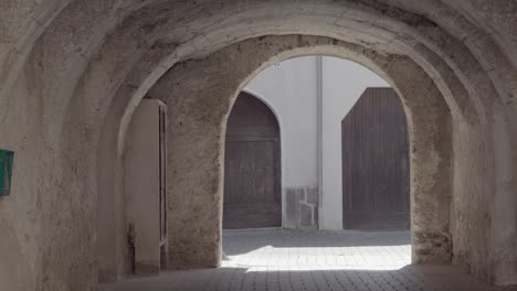 Zooming-out-on-an-arched-driveway-to-a-house-in-Caldonazzo,-Valsugana,-Trento,-Italy