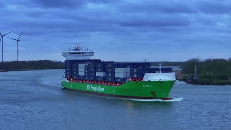 Container-vessel-BG-Green-sailing-onwards-to-port-destination,-aerial