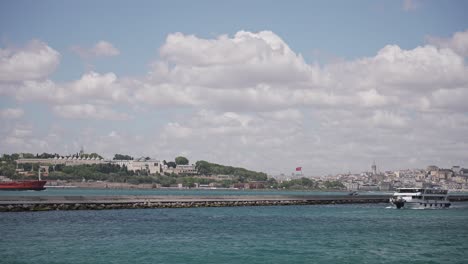 Ships,-ferries,-boats,-historical-buildings-in-the-Bosphorus,-Istanbul,-Turkiye