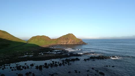 Wide-aerial-shot-of-the-Giant's-Causeway-in-County-Antrim,-Northern-Ireland-in-early-morning