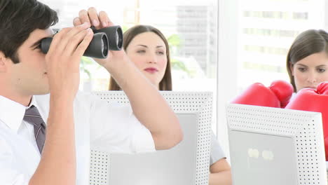 Businessman-looking-through-binoculars