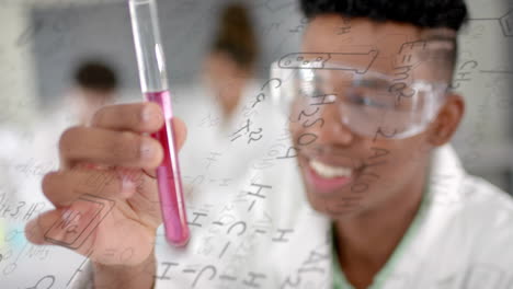 Animation-of-scientific-data-processing-over-african-american-male-student-in-laboratory