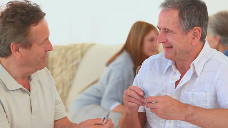 Elderly-friends-playing-cards-