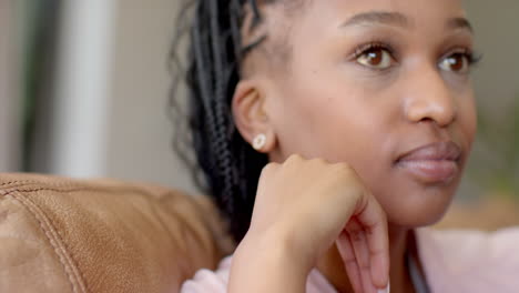 A-young-African-American-woman-with-braided-hair-is-thinking