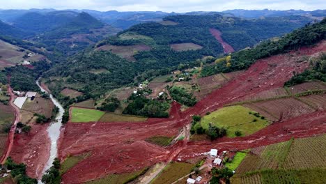 Land-mass-flood-devastation-results,-habitats-destroyed-by-mud,-aerial