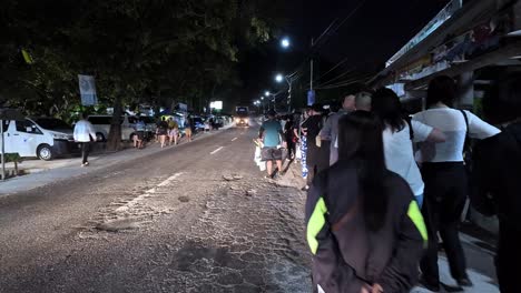 Philippines,-Oslob:-The-video-captures-a-group-of-tourists-at-six-in-the-morning,-waiting-in-line-to-dive-with-whale-sharks