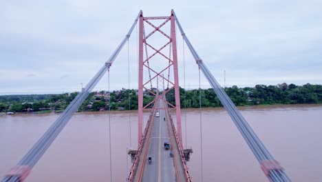Embark-on-an-exciting-drone-flight-between-the-cables-of-Puerto-Maldonado's-iconic-bridge
