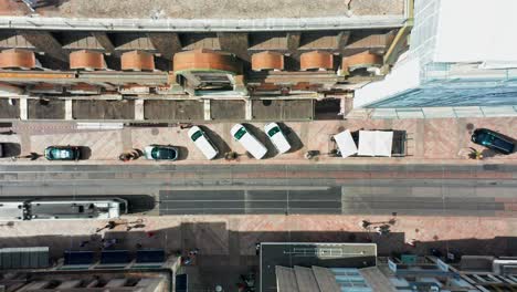 Beautiful-top-down-aerial-of-a-busy-street-in-down-town-Geneva