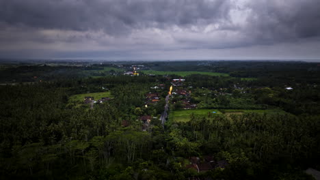 Hyperlapse-timelapse-of-cars-driving-along-road-in-Indonesian-countryside-at-sunset