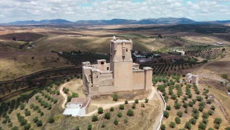 Historic-belalcazar-castle-surrounded-by-olive-groves-in-cordoba,-spain,-aerial-view