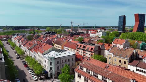 Klaipeda's-charming-old-town-with-red-rooftops-and-tree-lined-streets-in-lithuania,-aerial-view