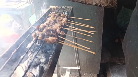 Grilling-Maranggi-Satay-over-lit-charcoal_slow-motion