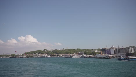 Ships,-ferries,-boats,-historical-buildings-in-the-Bosphorus,-Istanbul,-Turkiye