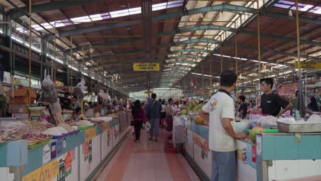 Bustling-Indonesian-indoor-market-with-people-shopping-for-fresh-produce-and-goods