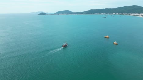 tourist-pirate-ship-and-scallop-boats-Florianópolis,-Brazil