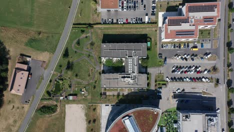 Top-down-aerial-of-an-elderly-care-home,-the-drone-slowly-ascends