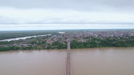 Witness-the-urban-bustle-over-the-Continental-Bridge-of-Puerto-Maldonado-in-this-thrilling-drone-flight