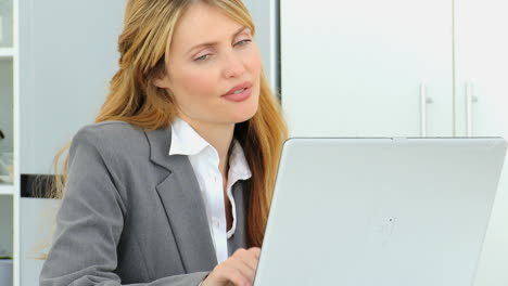 Businesswoman-working-on-her-laptop