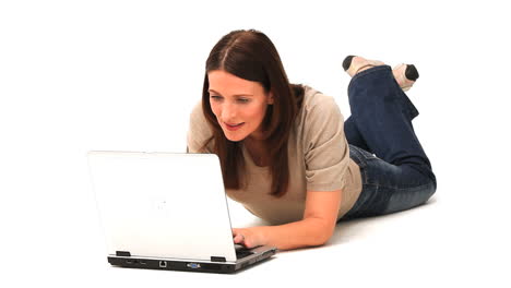 Brunette-enjoying-her-chat-on-a-laptop