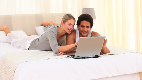 Lovely-couple-using-a-laptop-