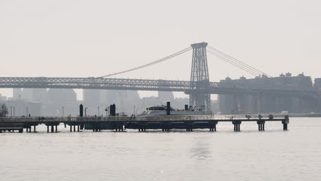 Ferry-Boat-Docked-And-People-Boarding-On-A-Overcast-Day