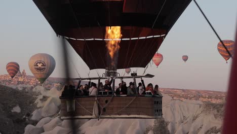 Long-shot-of-people-on-the-hot-air-balloon-landing-in-the-distance