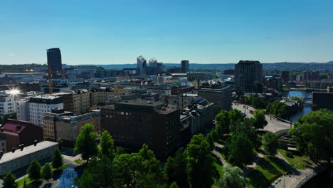 Aerial-view-circling-the-downtown-of-Tampere,-sunny,-summer-day-in-Finland