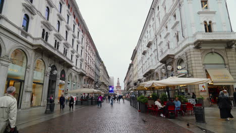 Bustling-Milan-street-scene-with-historical-architecture-and-pedestrians