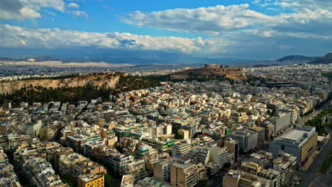 Aerial-view-of-the-skyline-of-Athens,-Greece,-Acropolis-in-distance