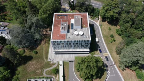 Aerial-of-facade-of-beautiful-apartment-building-with-a-terrace-on-the-rooftop