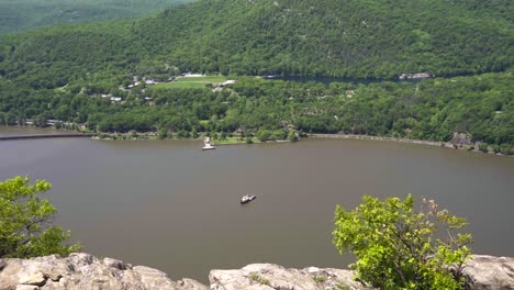 Man-Sitting-On-Top-Of-A-Mountain-Adoring-The-Views