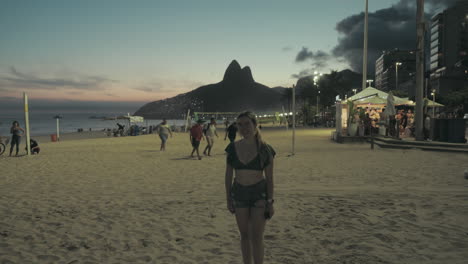 Tourist-woman-in-Ipanema-Beach-at-sunset