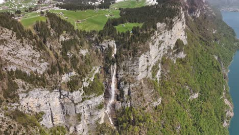 Bird's-eye-view-of-the-Seerenbachfälle-waterfalls,-with-their-imposing-and-picturesque-beauty,-along-the-shores-of-Lake-Walensee,-Switzerland